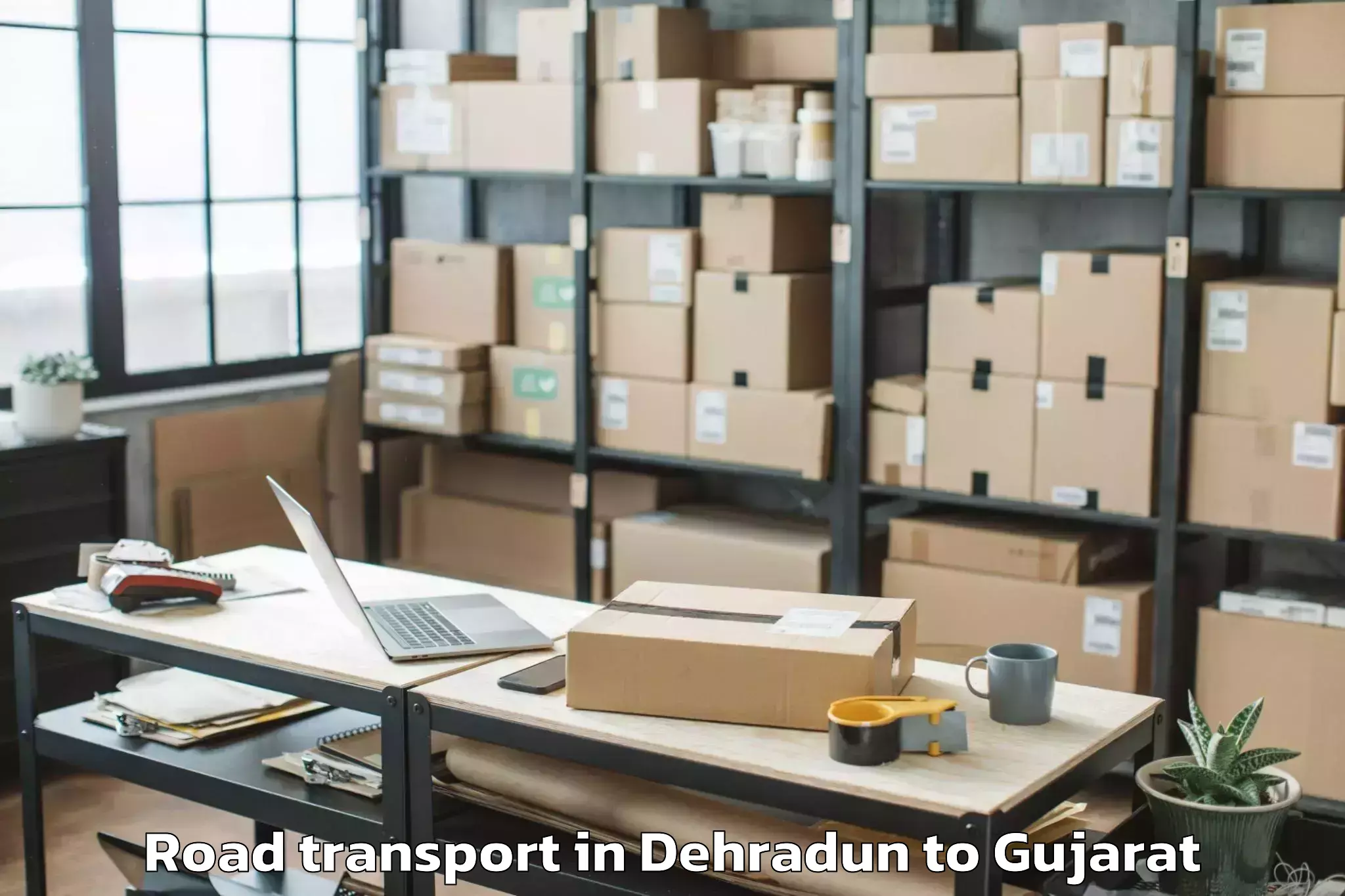 Book Dehradun to Vaghodia Ina Road Transport